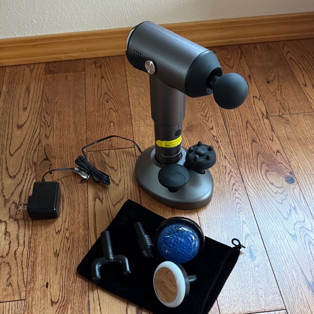 NuvoMed Massage Gun with 7 attachments